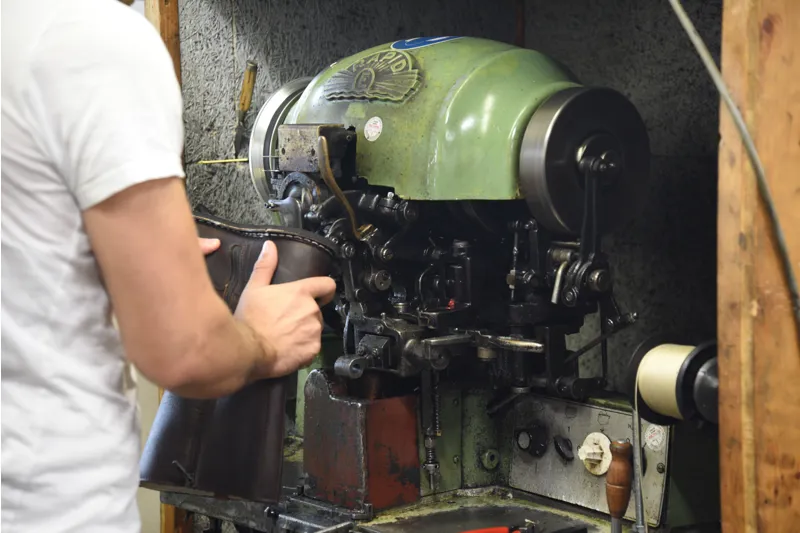 Meindl factory handcrafting boot soles