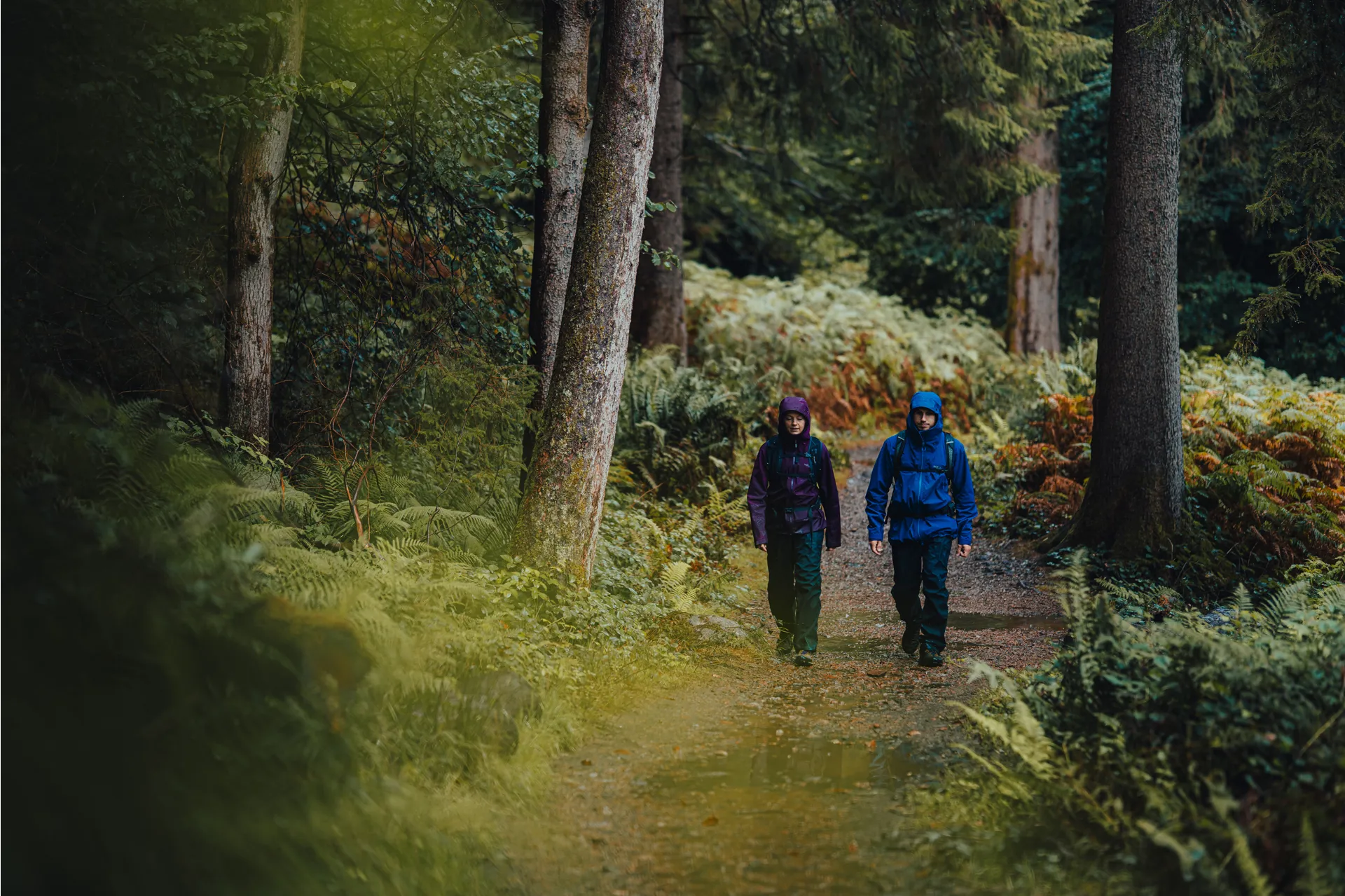 Cinchable hem and high-wear areas on a hiking waterproof jacket