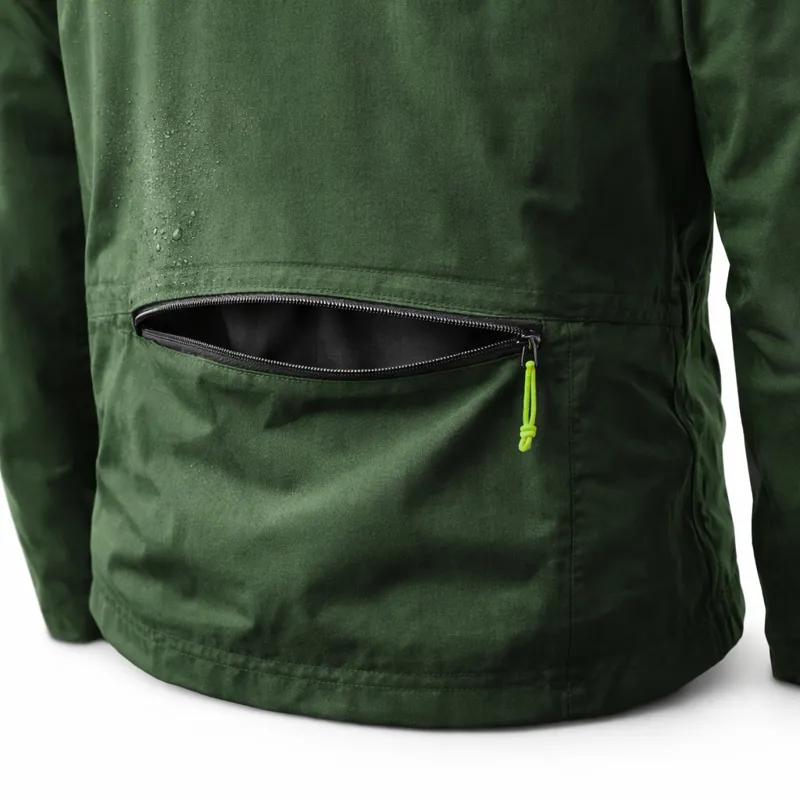 Rear pocket access on a cycling waterproof jacket